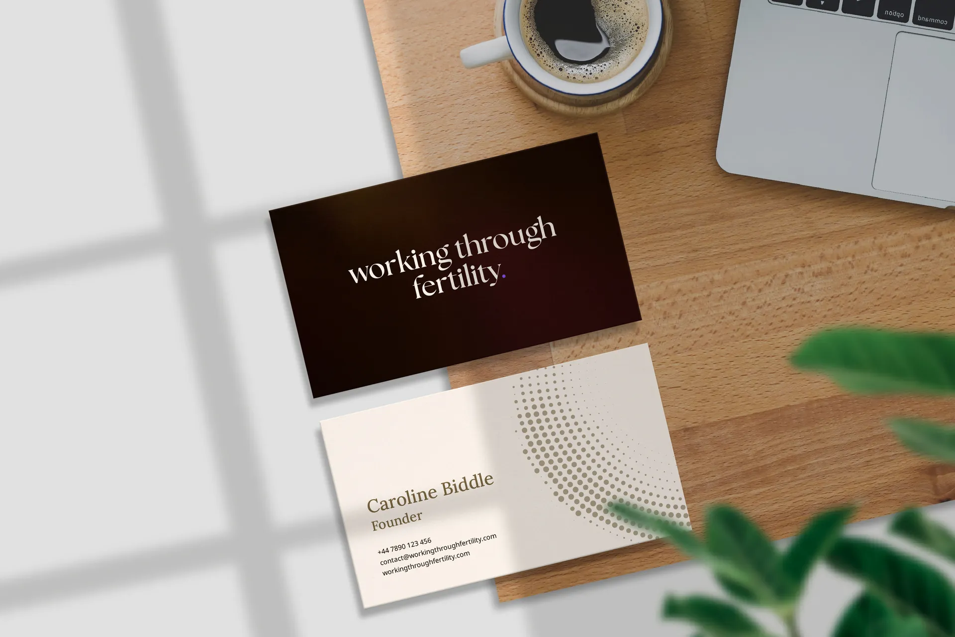 Working Through Fertility business cards on a desk. print design by Berlew Design Studio.