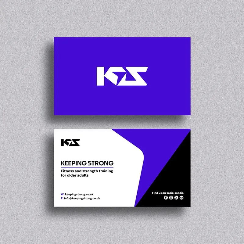 A business card for Keeping Strong, a fitness and strength training company for older adults, featuring a purple and black color scheme with white and black text. The card is displayed against a gray background.